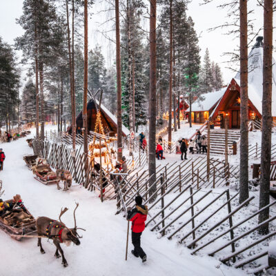 Reindeer sleighs departing at Santa Claus Reindeer in Santa Claus Village, Rovaniemi, Finland