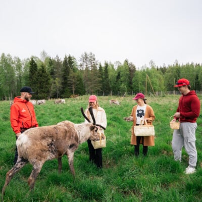 People are having fun outdoors at the campfire
