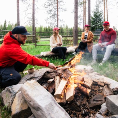 People are having fun outdoors at the campfire