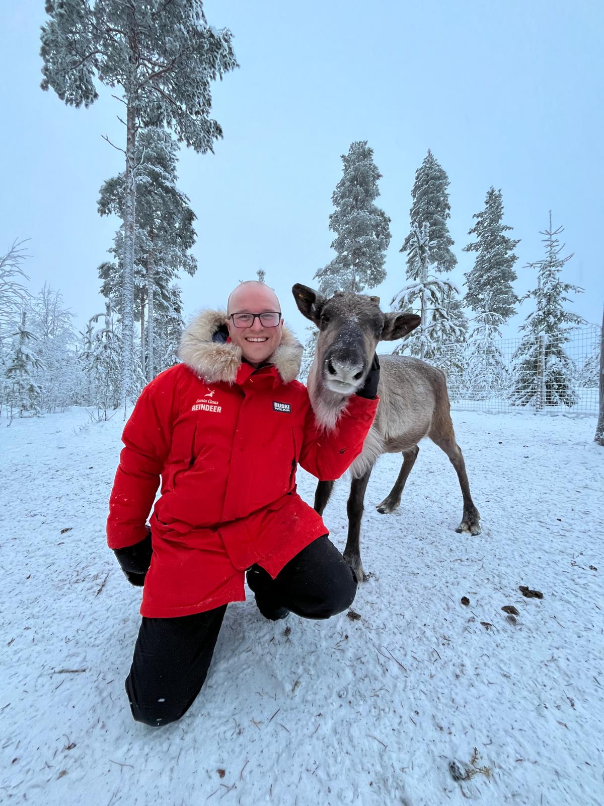 Olli Heikkilä, Santa Claus Reindeer Guide posing with a reindeer