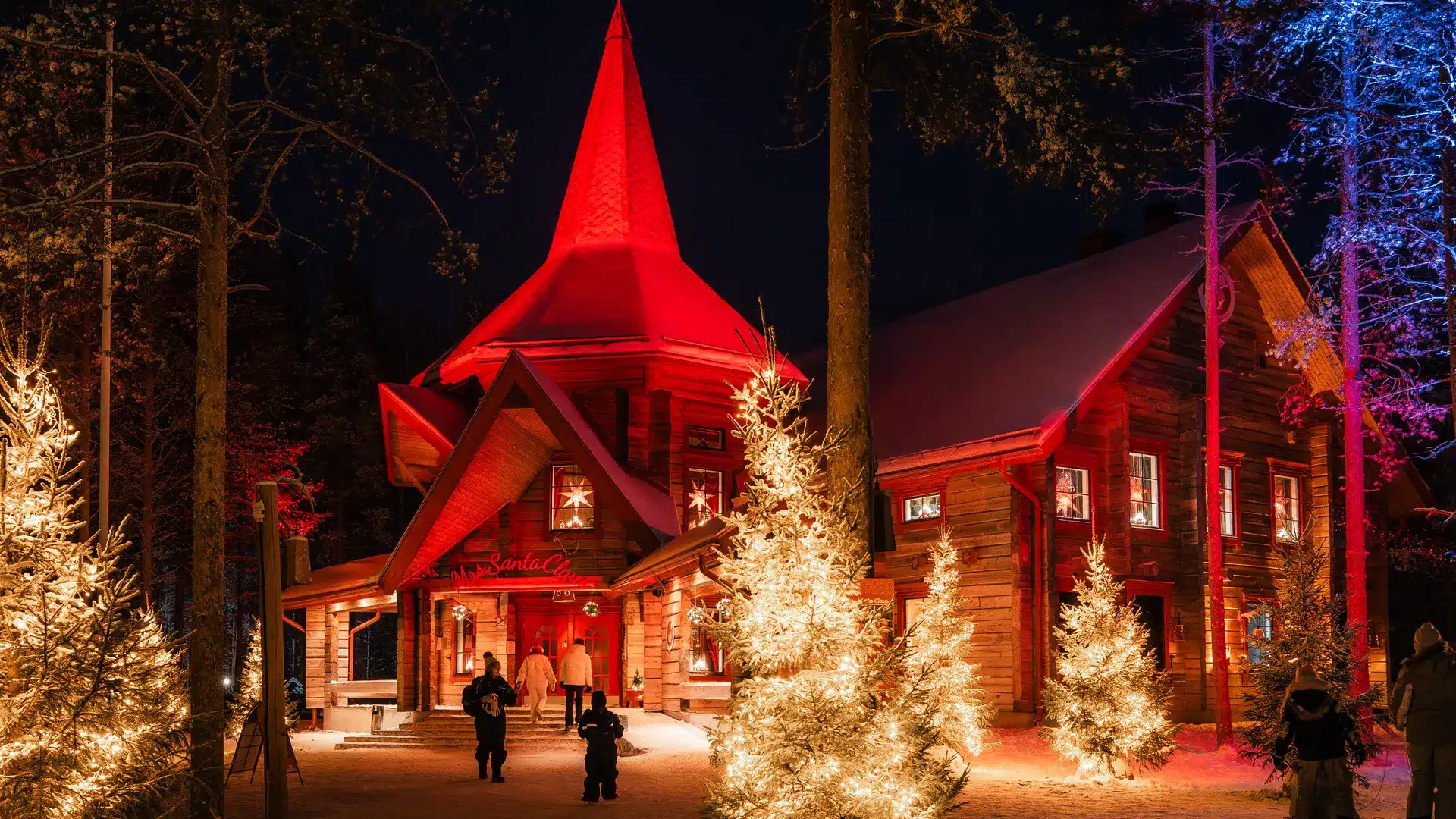Santa Claus Village Christmas cottage lit at night